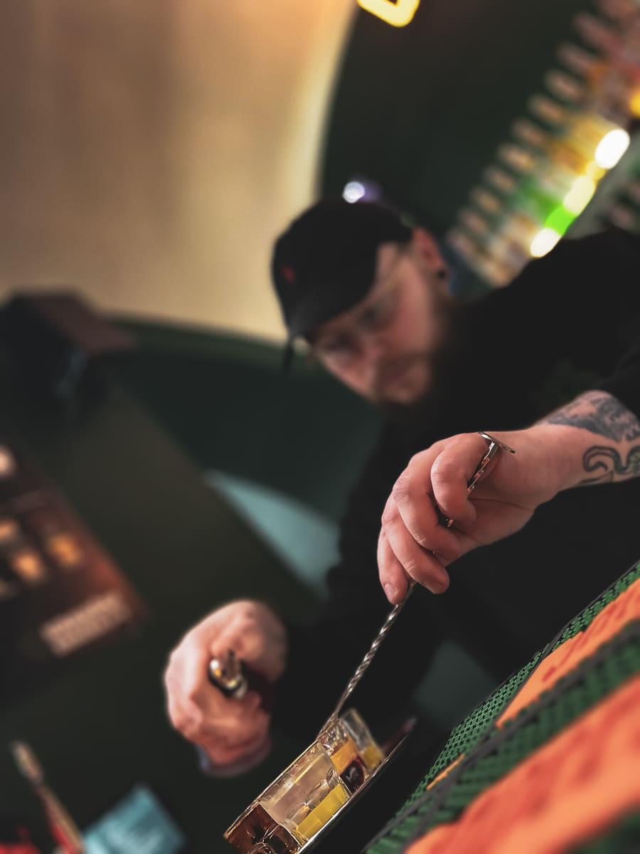 Bartender pouring shots